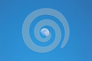 Daytime moon and blue sky