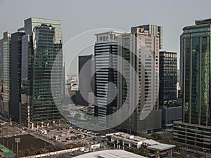 A daytime view of the BGC business district skyline in Metro Manila, showcasing modern and glassy high-rise office buildings