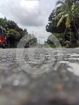 A daytime view of a tarmac road in Sri Lanka with heavy traffic.