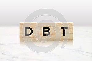 DBT on Wooden Blocks - Dialectical Behavior Therapy Mental Health Concept