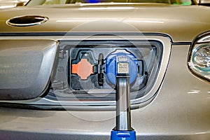 DC electric plug connected to a vehicle for battery fulfil from charging station