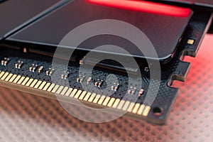 DDR4 DRAM memory module close-up in red light