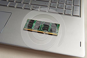 DDR3 sodimm RAM memory card module in black laptop closeup