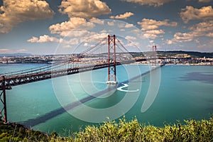 The 25 de Abril Bridge is a bridge connecting the city of Lisbon photo