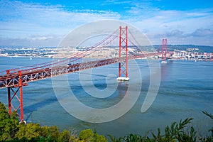 25 de Abril bridge, or Salazar bridge seen from Almada to Lisbon-Portugal. photo