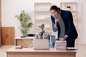 Dead employee working in the office