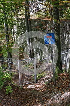 Dead end in the forest at the fence