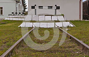 Dead end no through train railroad traffic sign isolated old grungy railway stop signal. photo