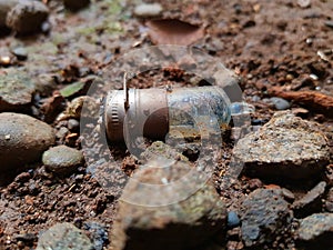 The dead light bulb on the ground