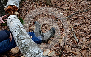 Dead man covered with a tree. the tree turned upside down and injured itself, falling while walking on a hiker, a forest worker. l