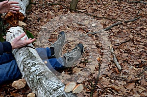 Dead man covered with a tree. the tree turned upside down and injured itself, falling while walking on a hiker, a forest worker. l