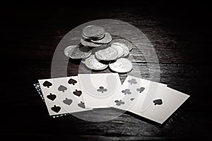 Dead man\'s hand and silver coins bet. Two-pair poker hand consisting of the black aces and black eights, held by Old West photo