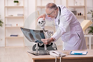 Dead patient visiting old male doctor radiologist