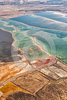 Dead Sea Israel landscape nature salt extraction portrait format from above aerial view Jordan