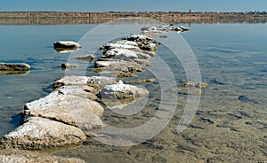 Dead Sea - Kuyalnik estuary, precipitation of self-precipitating salt on the rocks