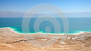 Dead Sea lake with salt water and curative mud shores beaches photo