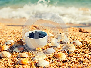 Dead sea mud in a cup on the beach