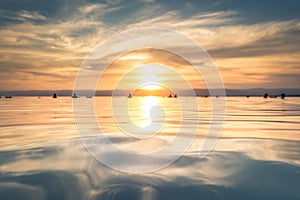 Dead Sea - October 05, 2018: Tourists bathing in the salty Dead Sea by sunset, Jordan