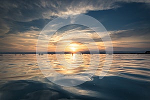 Dead Sea - October 05, 2018: Tourists bathing in the salty Dead Sea by sunset, Jordan