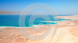 Dead Sea salt lake surface shore and beach