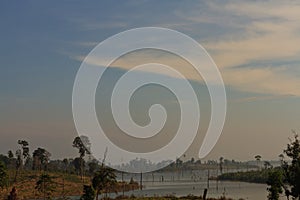 Dead trees in the reservoir with blue sky - Thakhek Loop