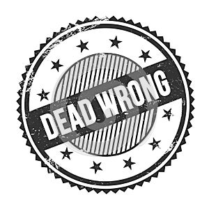 DEAD WRONG text written on black grungy round stamp