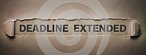 Deadline Extended text on torn paper