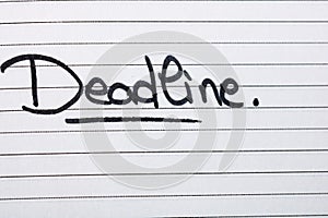 Deadline, handwriting text on page of office agenda. Copy space