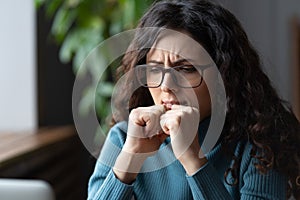 Deadline stress. Young worried anxious businesswoman in glasses dealing with work anxiety