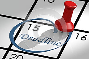 Deadline word marked on calendar with push pin