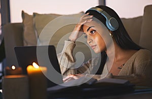 These deadlines creep up on you so fast. Cropped shot of an attractive young woman working late at night in her living