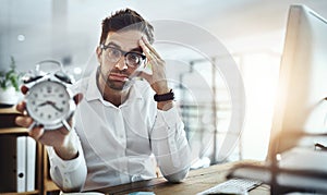 These deadlines wont reach the finishing line in time. Portrait of a young businessman looking stressed out while