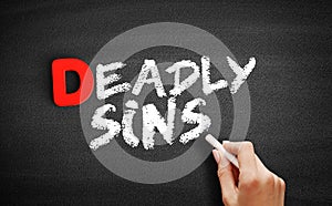 Deadly sins text on blackboard photo