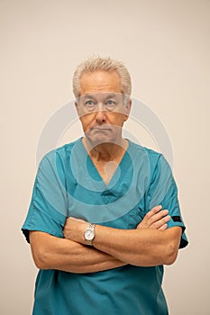 Deadpan expression doctor with arms crossed photo