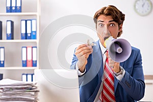 The deaf employee using hearing aid in office