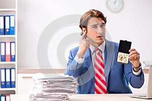 The deaf employee using hearing aid in office