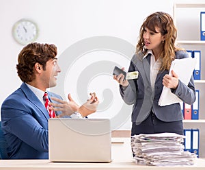 The deaf employee using hearing aid talking to boss