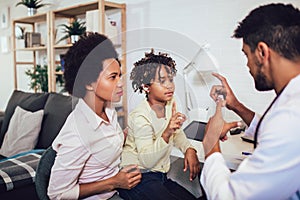 Deaf girl learning sign language at doctor`s office