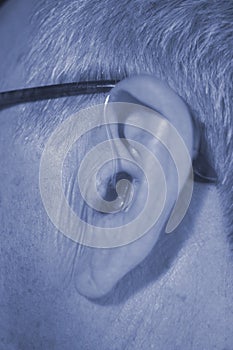 Deaf man hearing aid ear