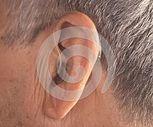 Deaf man hearing aid ear