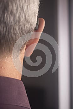 Deaf man hearing aid ear