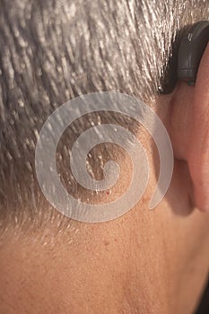 Deaf man hearing aid ear