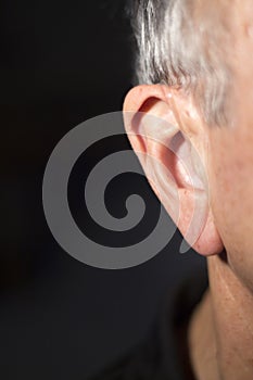 Deaf man hearing aid ear