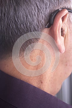 Deaf man hearing aid ear