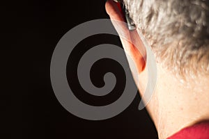 Deaf man hearing aid ear