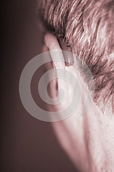 Deaf man hearing aid ear