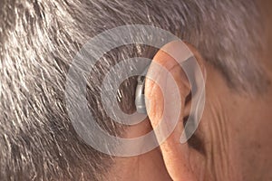 Deaf man hearing aid ear