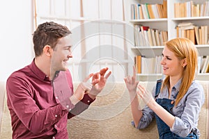 Deaf man with his girlfriend using sign language