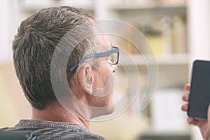 Deaf man using sign language on the smart phone