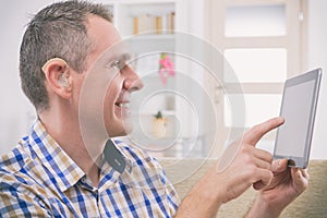 Deaf man using sign language on the tablet